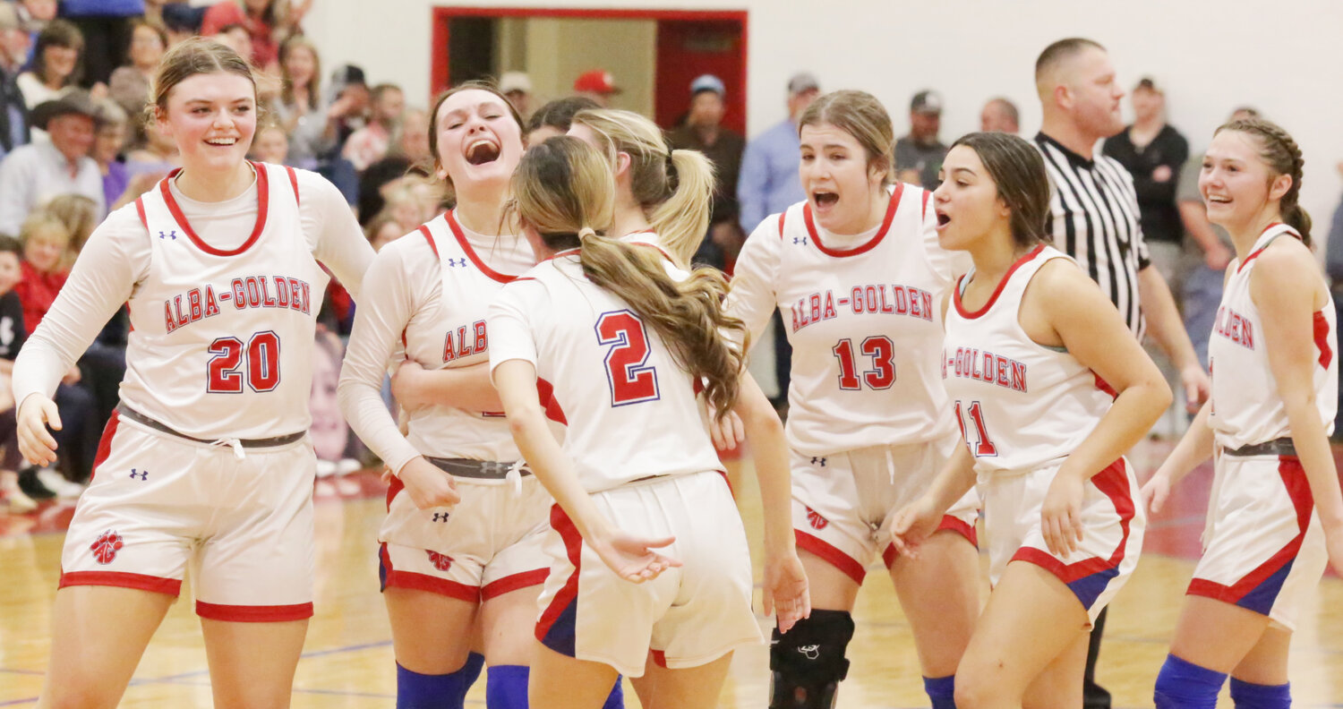 Alba-Golden celebrates Joecey Lewers’ long-range buzzer-beater to end the first half against Cooper.